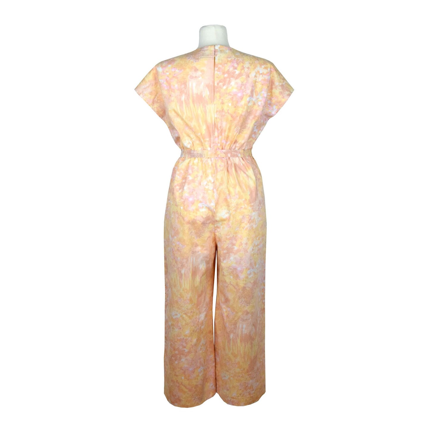 Upcycling summer overall for women with short sleeves. Upcycled cotton fabric with abstract pastel rose and yellow pattern. V neck, loose fit with belt, pants length above the ankle