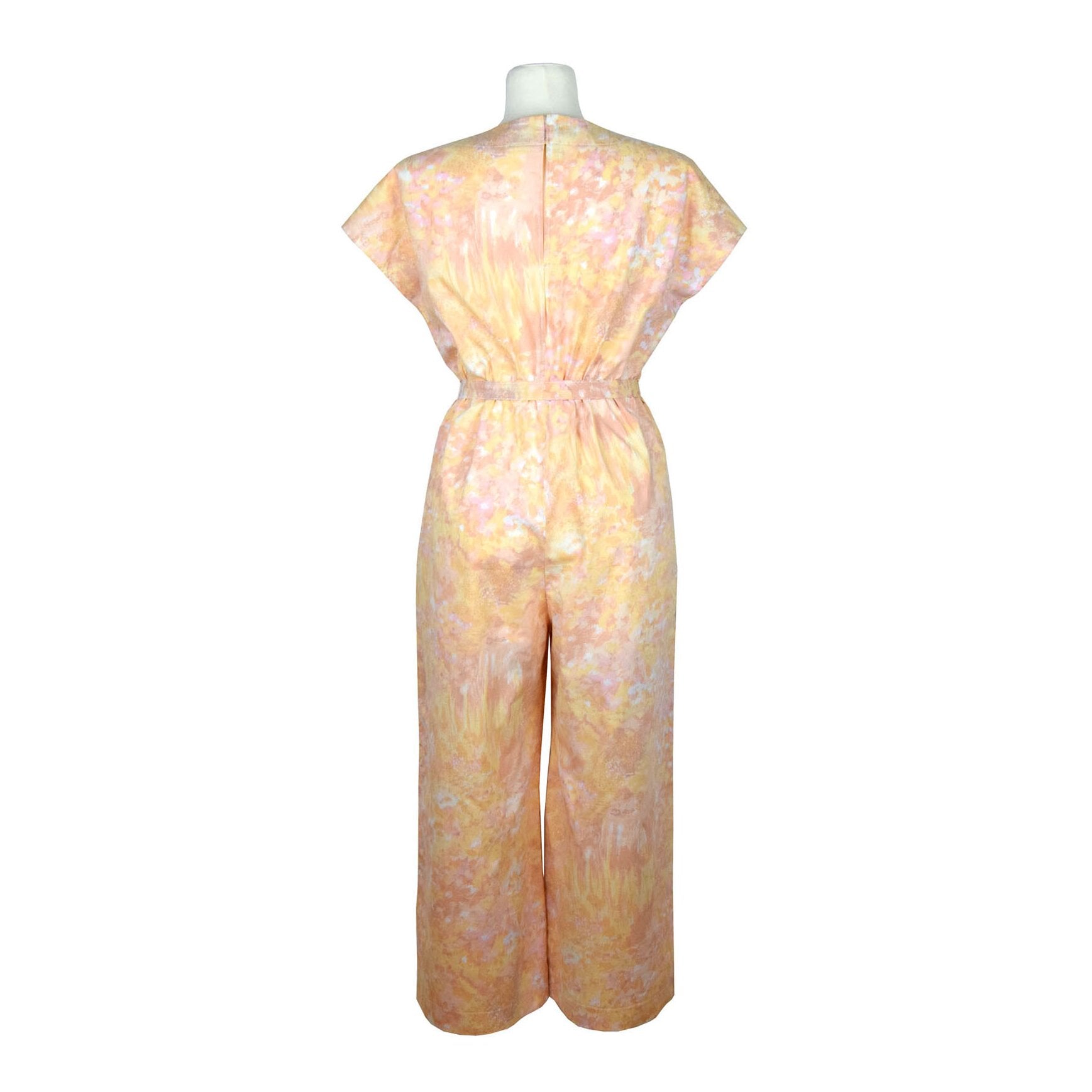 Upcycling summer overall for women with short sleeves. Upcycled cotton fabric with abstract pastel rose and yellow pattern. V neck, loose fit with belt, pants length above the ankle